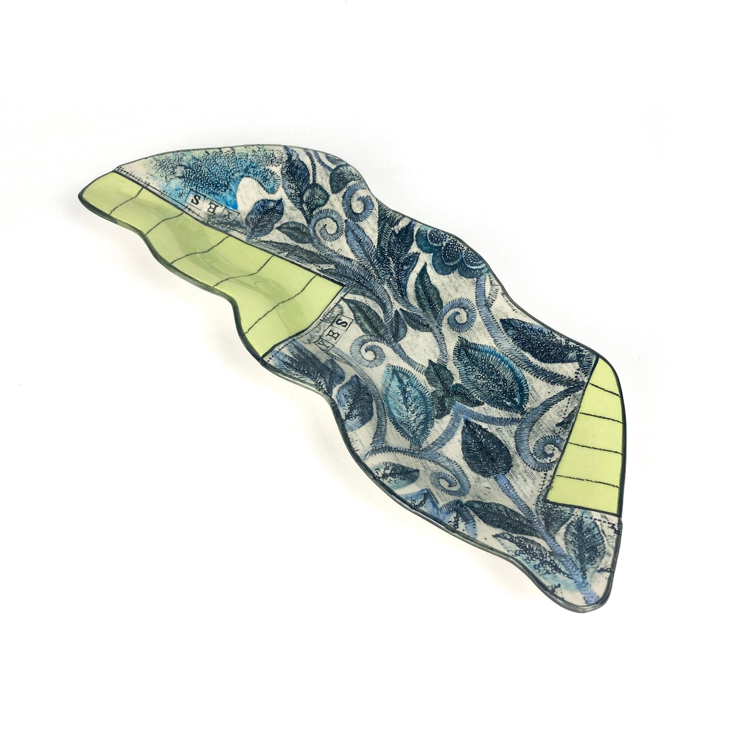 Curved Peapod Platter with intricate blue leaf patterns and geometric green accents on both ends.