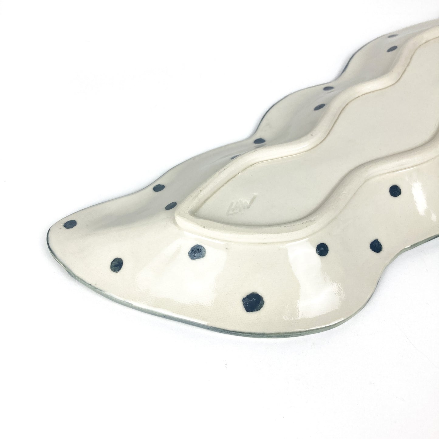 Close-up of the Peapod Platter’s end highlighting glossy green tilework and fine leaf-patterned texture.