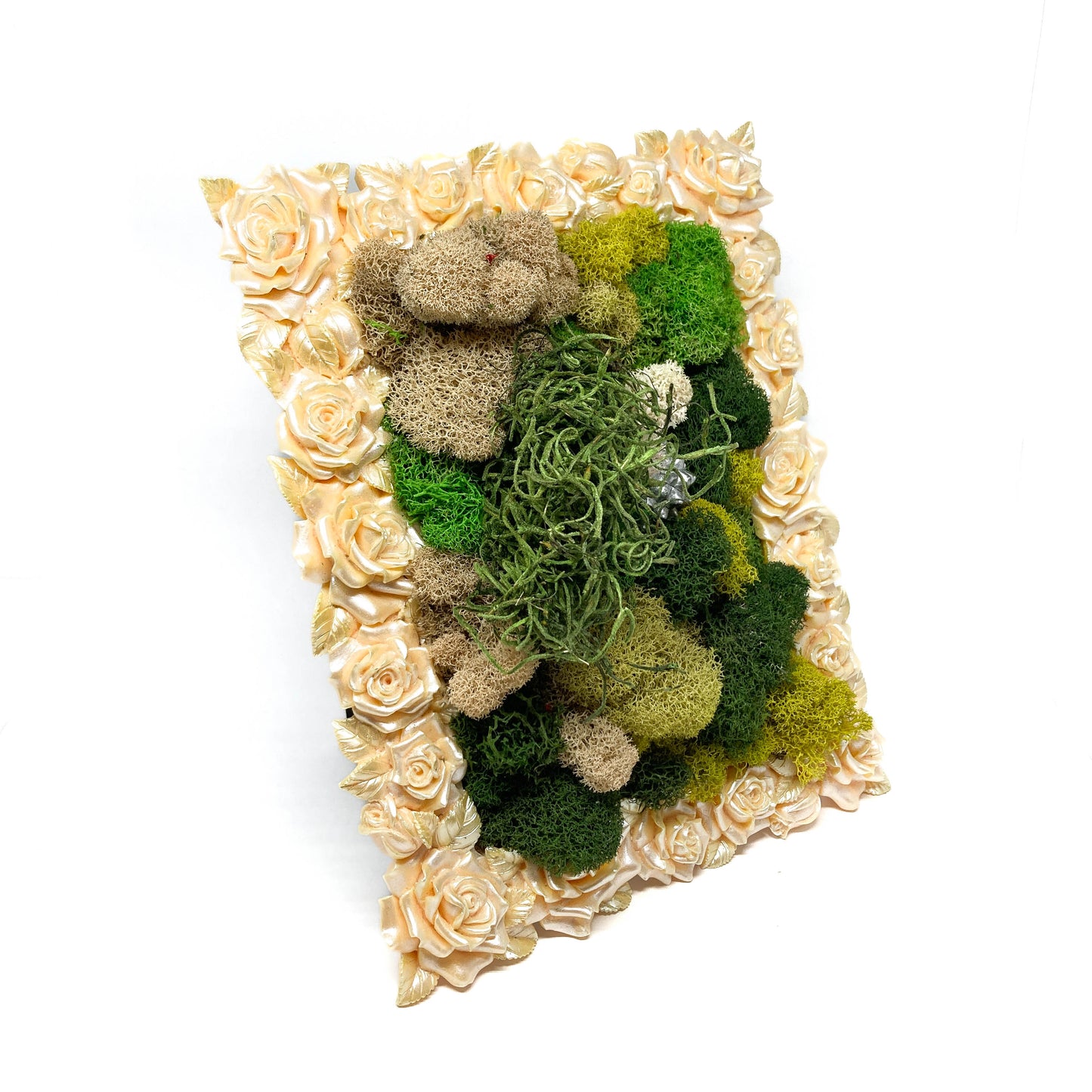 Framed artwork with preserved moss in various colors and textures, framed by a border of pale roses.