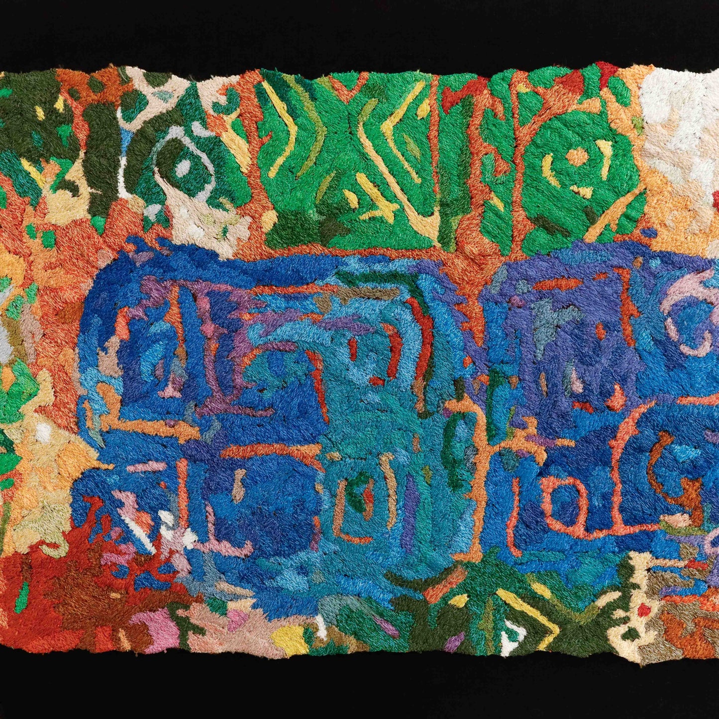 A close-up of a thread tapestry with abstract symbols, showcasing intricate stitching and colorful thread.