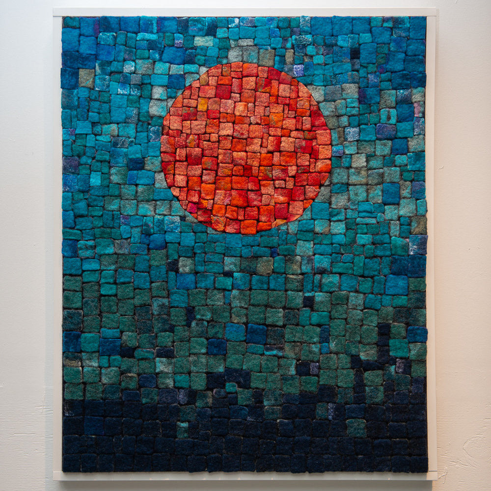 A textured mosaic of small squares forms a gradient, with a central orange circle.
