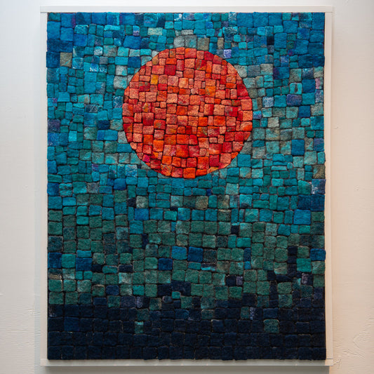 A textured mosaic of small squares forms a gradient, with a central orange circle.