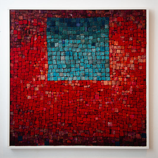 Mosaic art piece. A central blue square is surrounded by a red textured background.