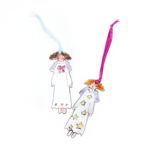 Two Christmas Angel Ornaments, one with a bow on the dress and the other with yellow stars and purple wings.