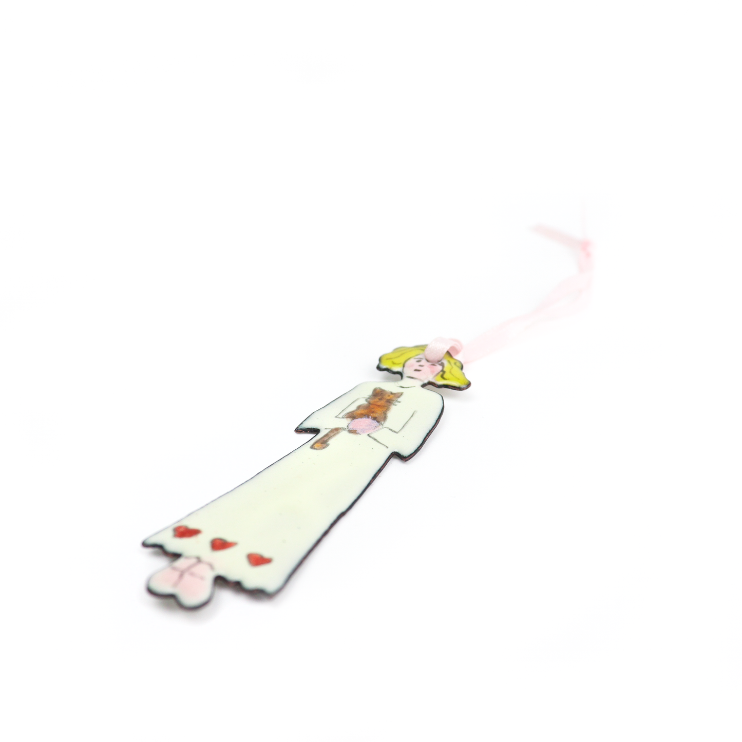 Side view of a Dolly Ornament featuring yellow hair, a small brown cat, and a dress decorated with red hearts.