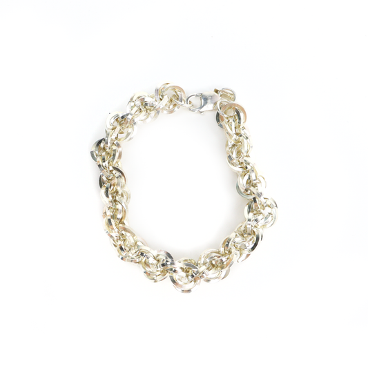 Heavy Kriss Kross Bracelet featuring interwoven polished silver rings and a secure lobster clasp.