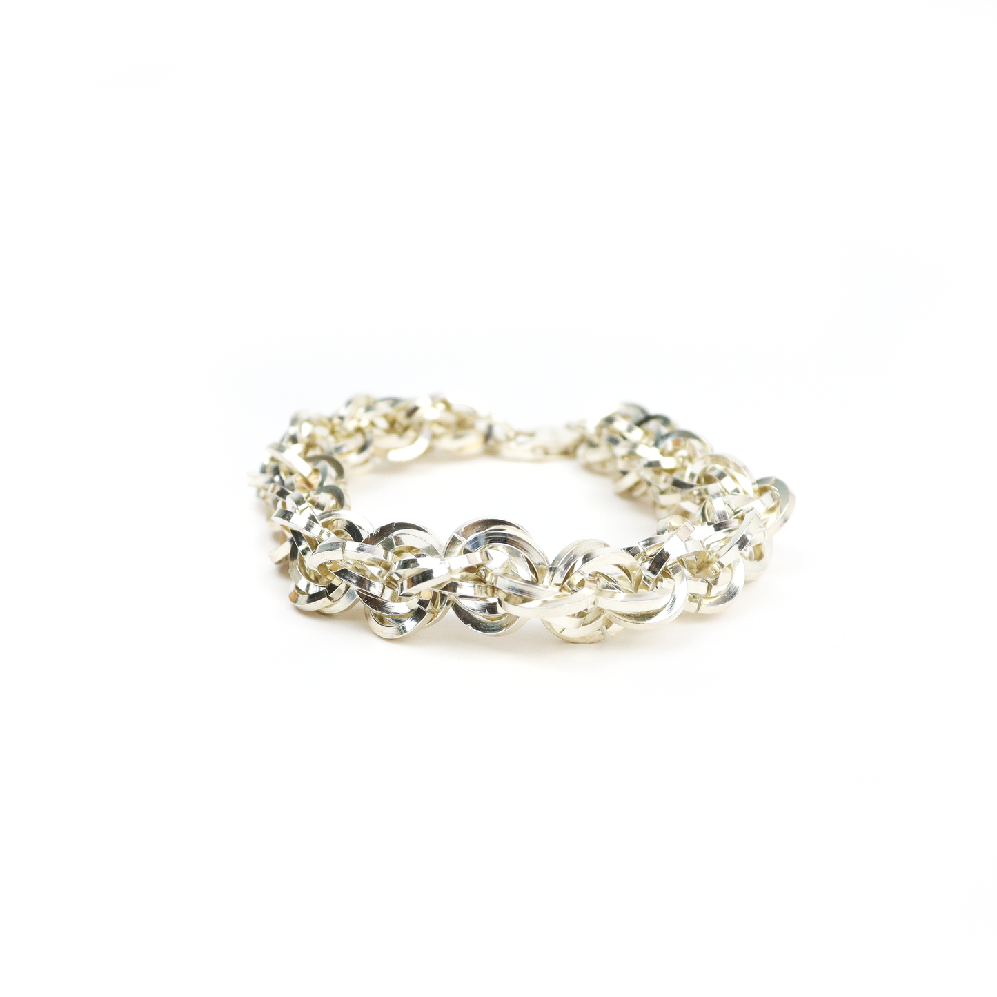 Close-up view of Heavy Kriss Kross Bracelet showing thick interlocked polished silver rings.