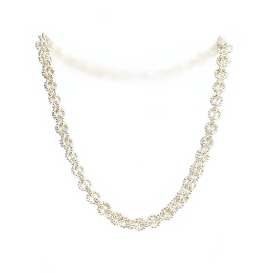 Chain Mail Necklace featuring intricate woven silver links creating a dense, textured pattern.
