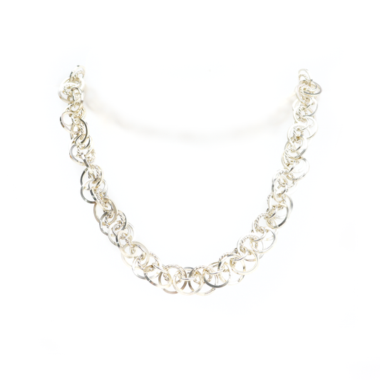 Heavy Loop Necklace featuring large interlocking silver rings in a bold, textured design.