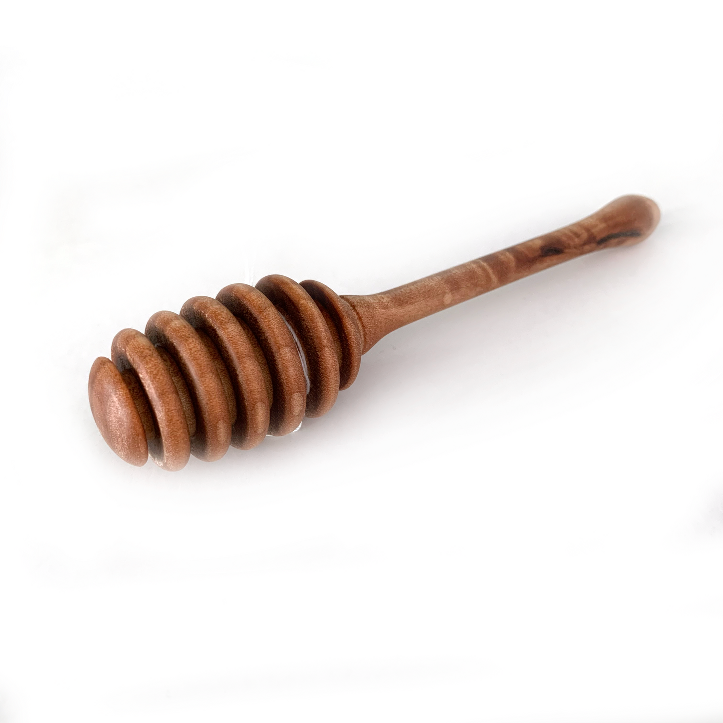 A dark wooden honey dipper with a grooved head.