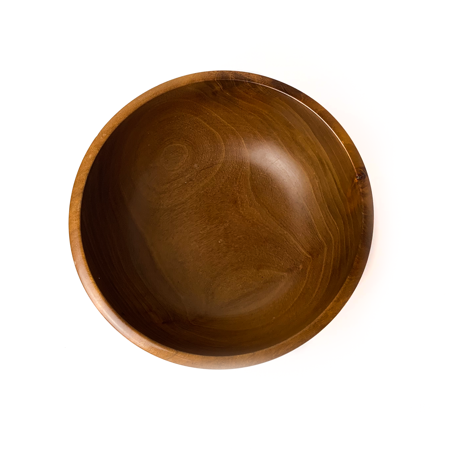 A brown wooden bowl with a smooth, rounded interior, top-down view.
