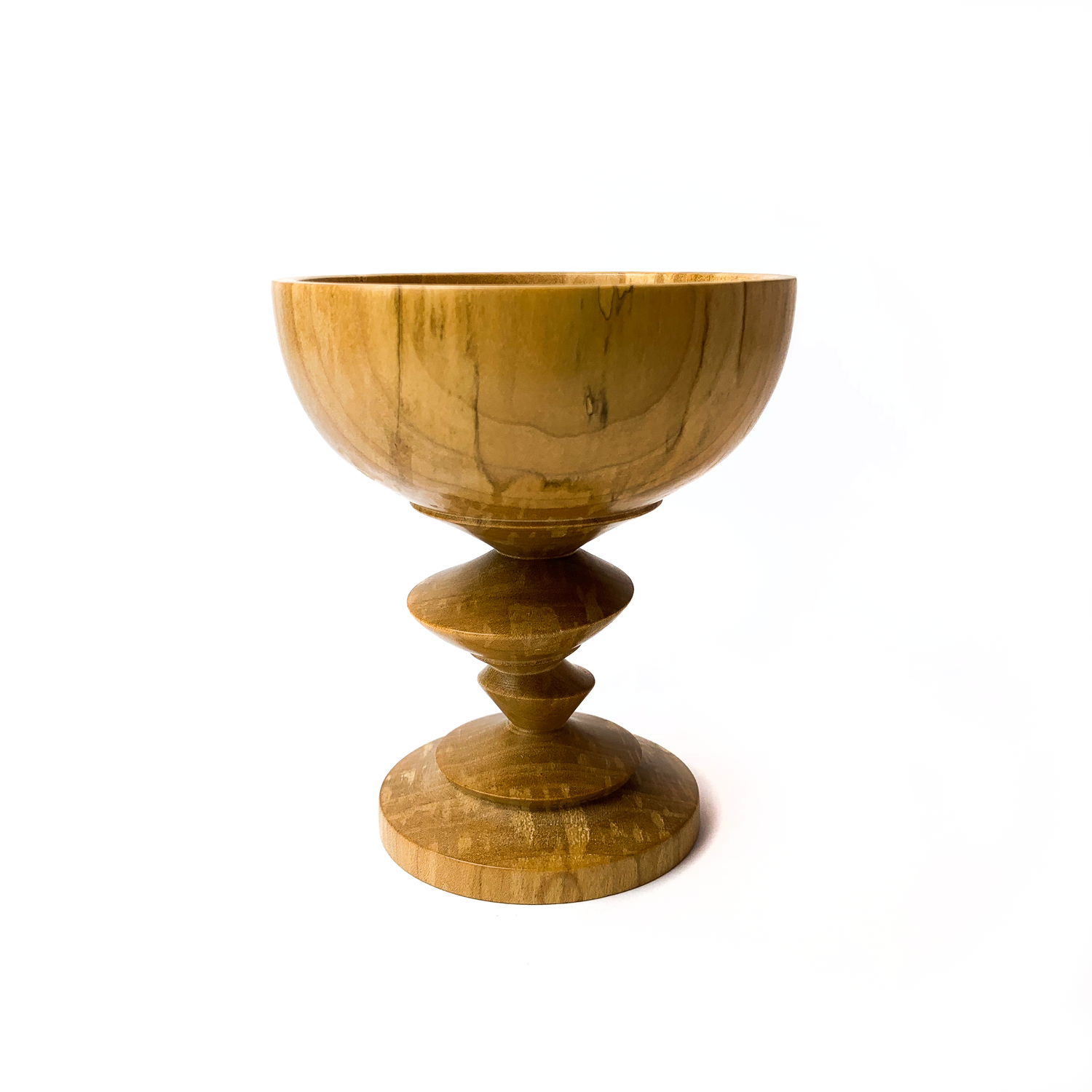 A light brown maple goblet with a rounded bowl and a twisted stem.