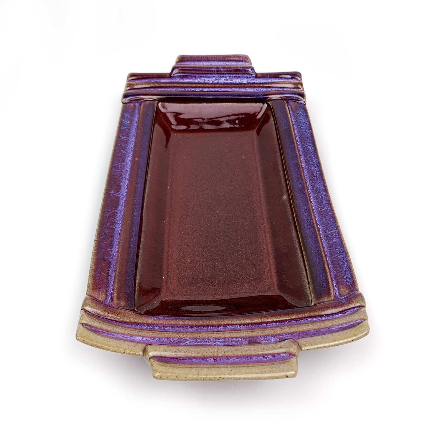A square, ceramic bonsai pot with a glossy purple glaze and decorative lines.