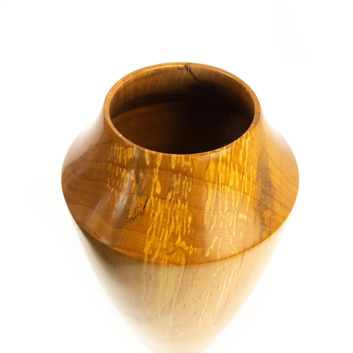 A light brown wooden vase, angled view.