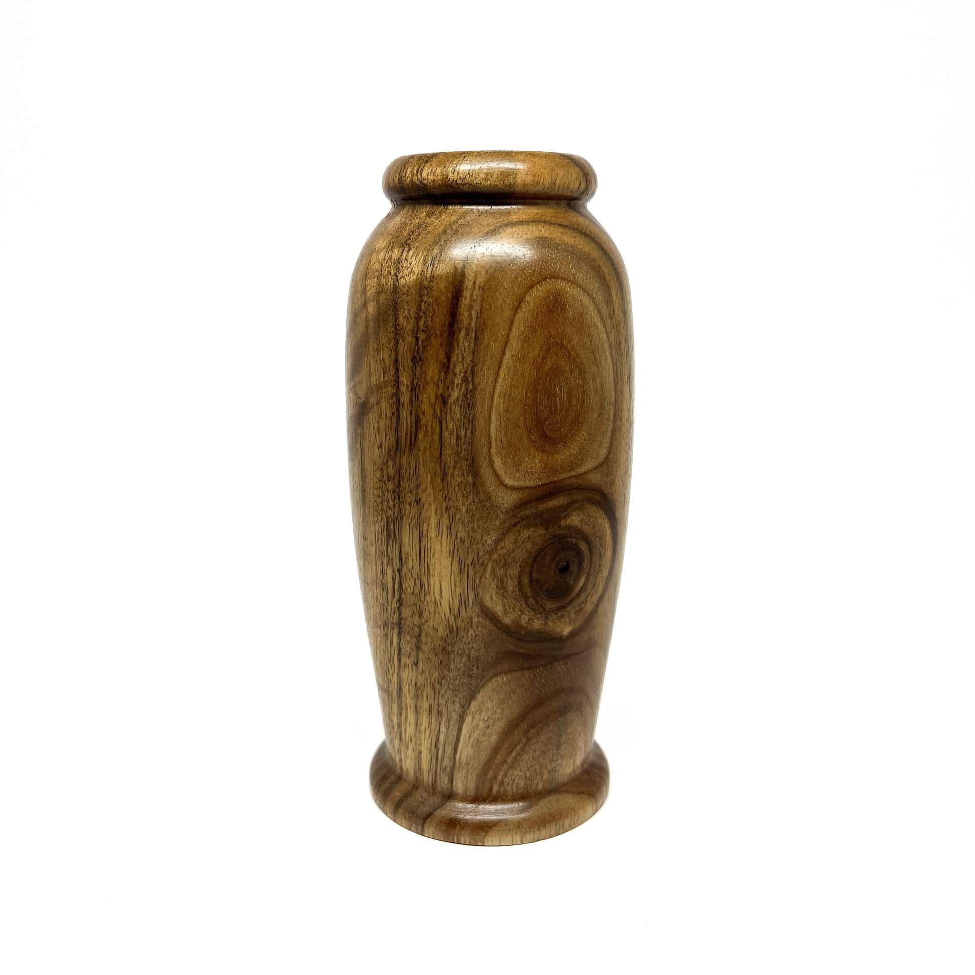 Small wooden hollowform vase with distinct natural wood grain patterns and a rounded base and rim.