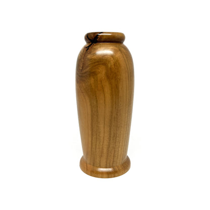 Small, smooth wooden vase with natural wood grain and a slightly rounded base and top.