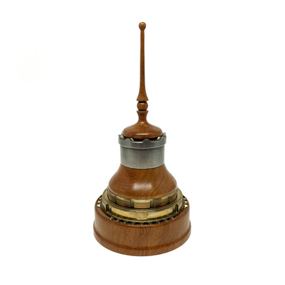 Wooden mixed media sculpture with a spire, metal accents, and intricate detailing.