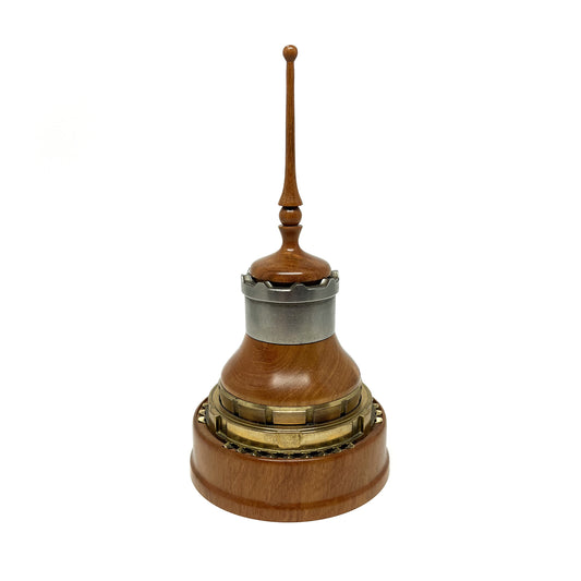 Wooden mixed media sculpture with a spire, metal accents, and intricate detailing.