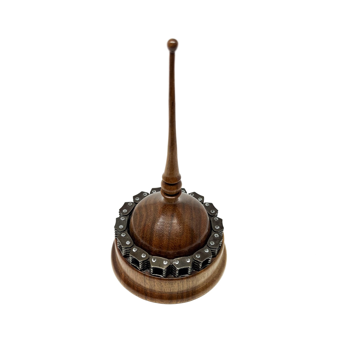 Wooden mixed media spire sculpture with a circular chain detail and a tall, slender, topped spire.