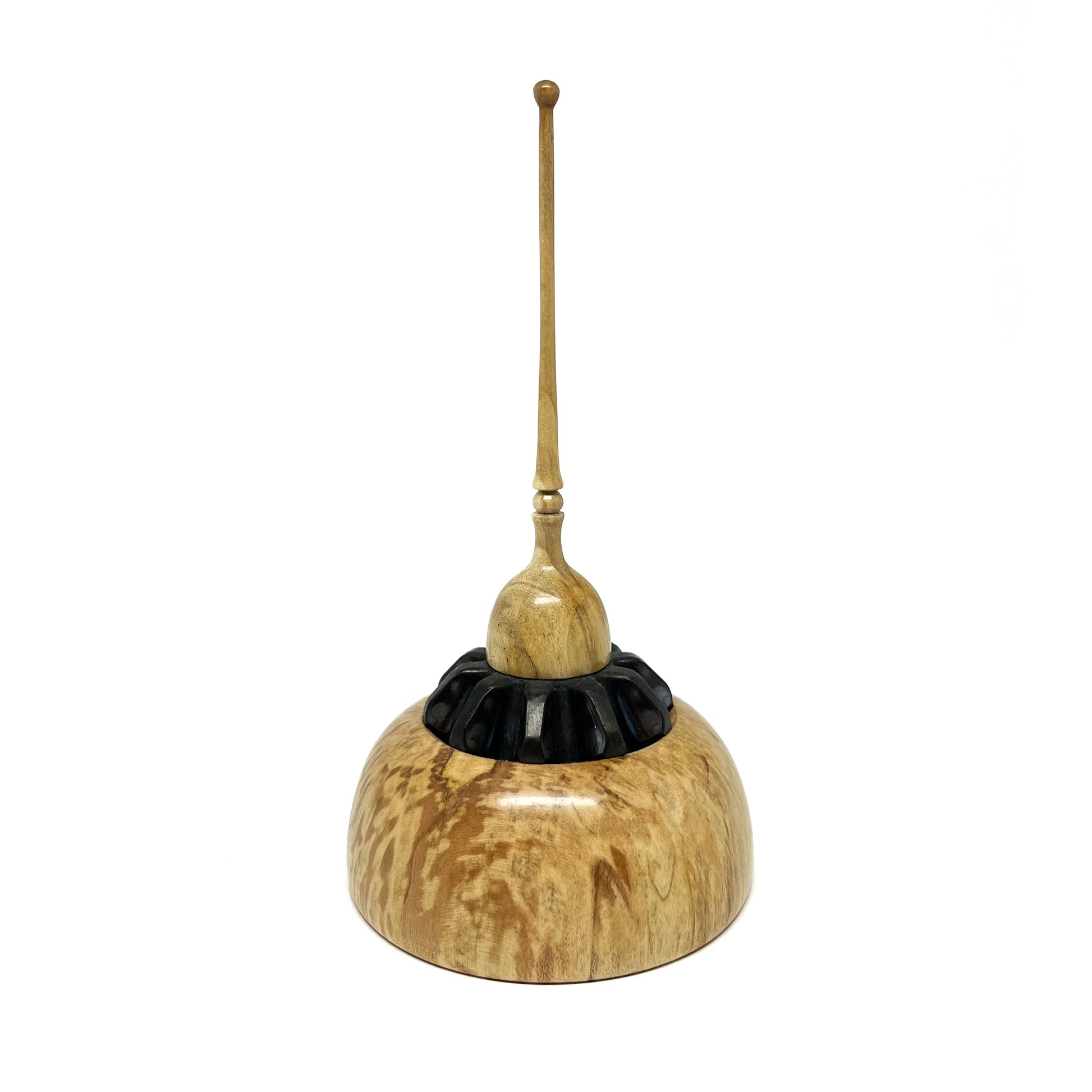 Small wood spire sculpture by David Adolph with a textured black ring and a slender, topped spire.