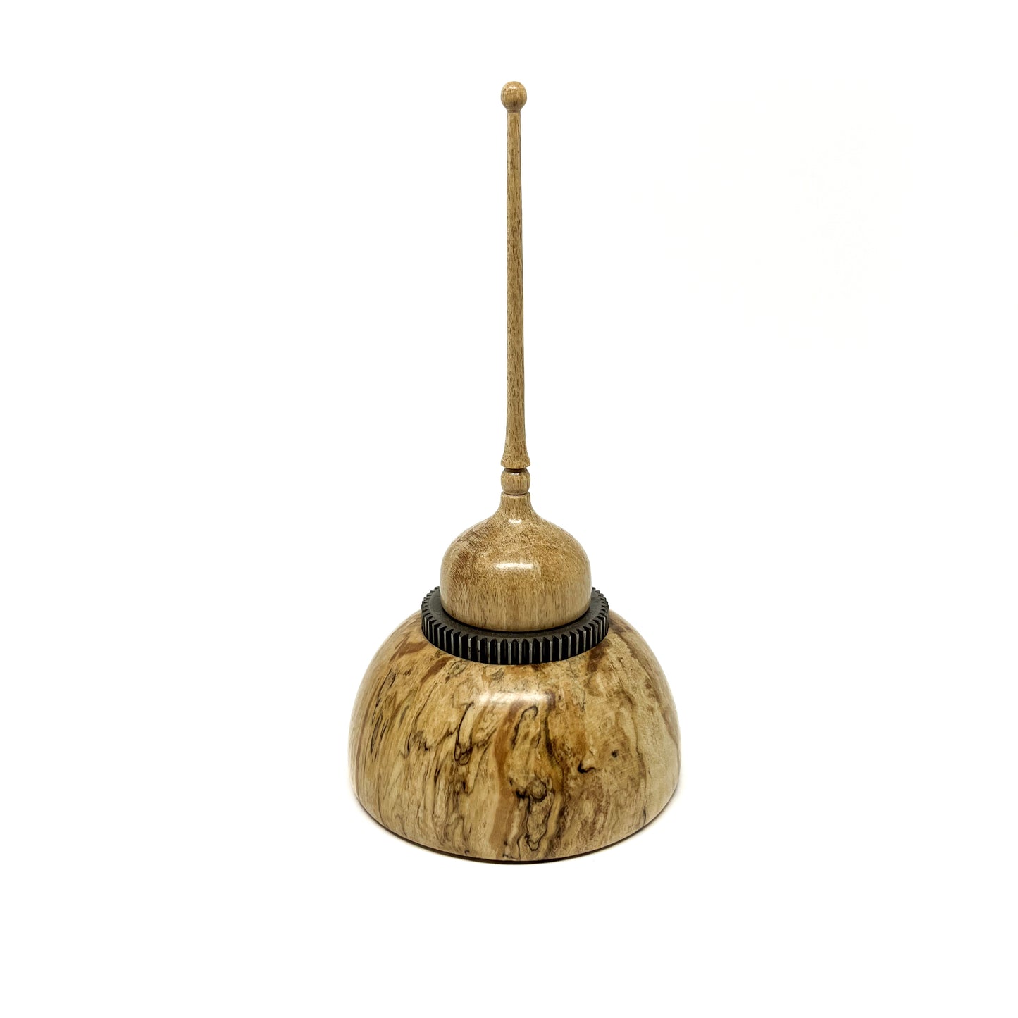 Small wood spire sculpture by David Adolph with a dark textured ring and a tall, slender, topped spire.
