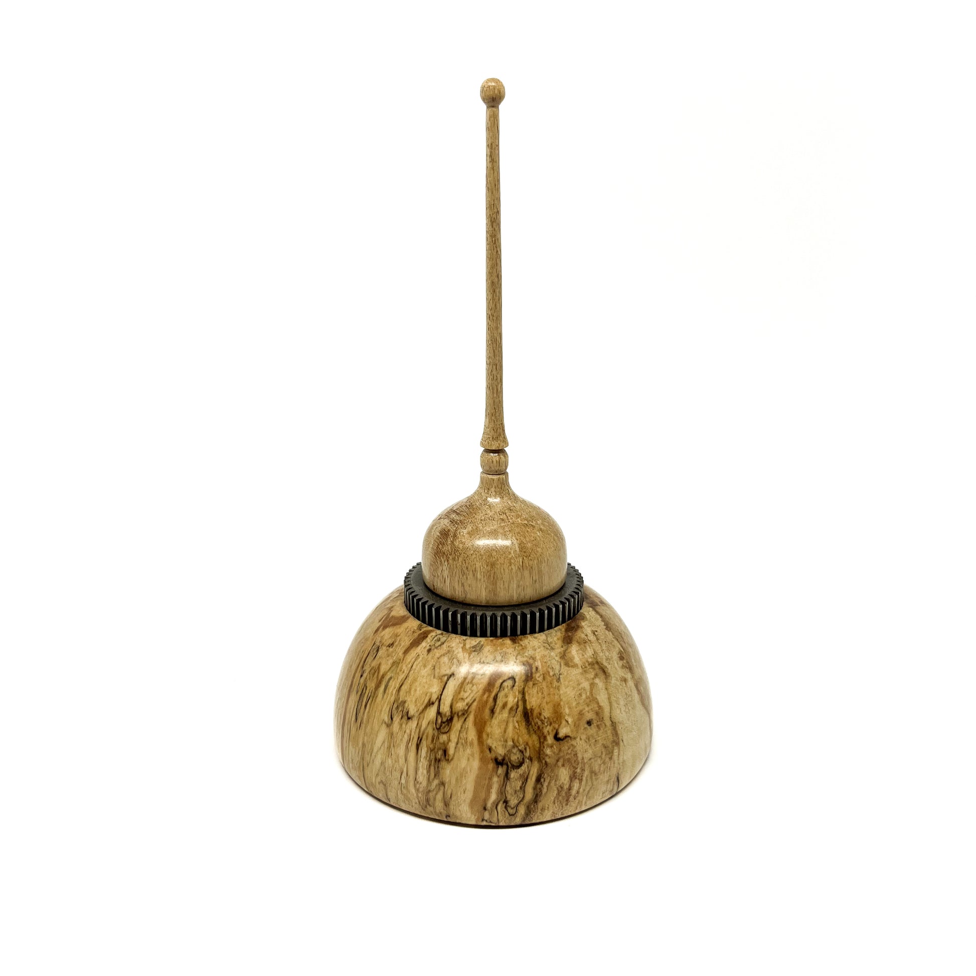 Small wood spire sculpture by David Adolph with a dark textured ring and a tall, slender, topped spire.