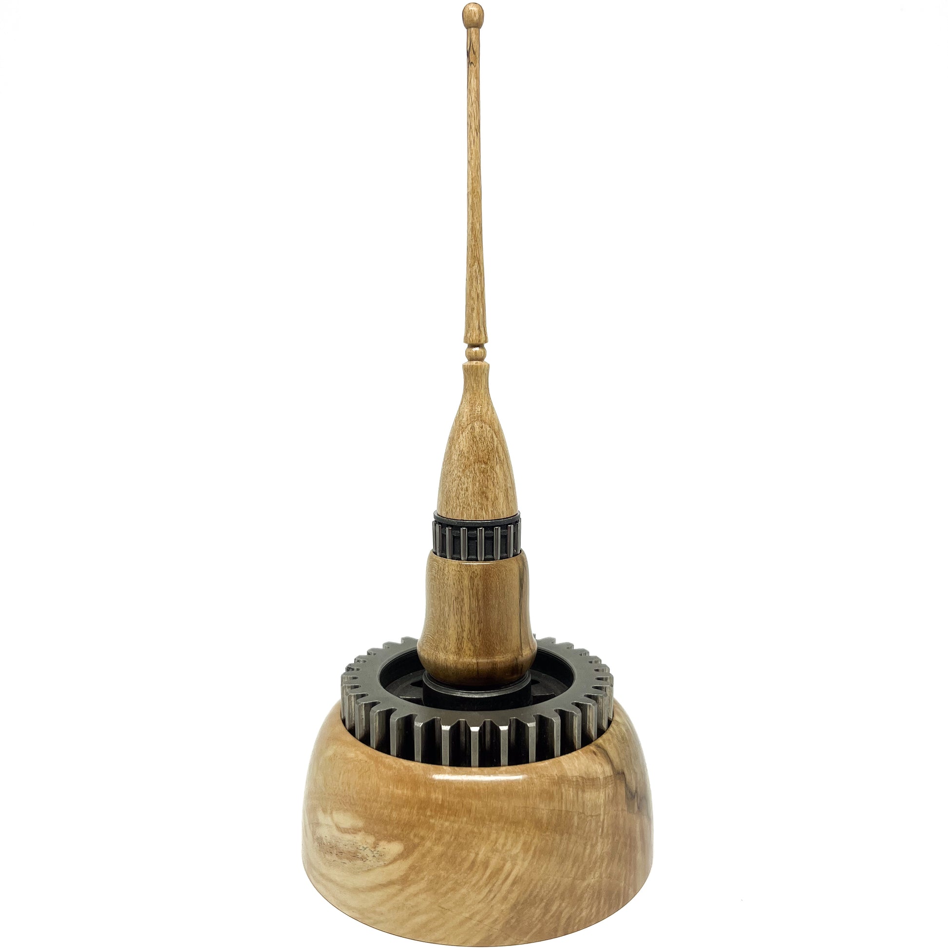 Stacked wood spire sculpture by David Adolph with two dark, textured rings and a tall, slender, topped spire.