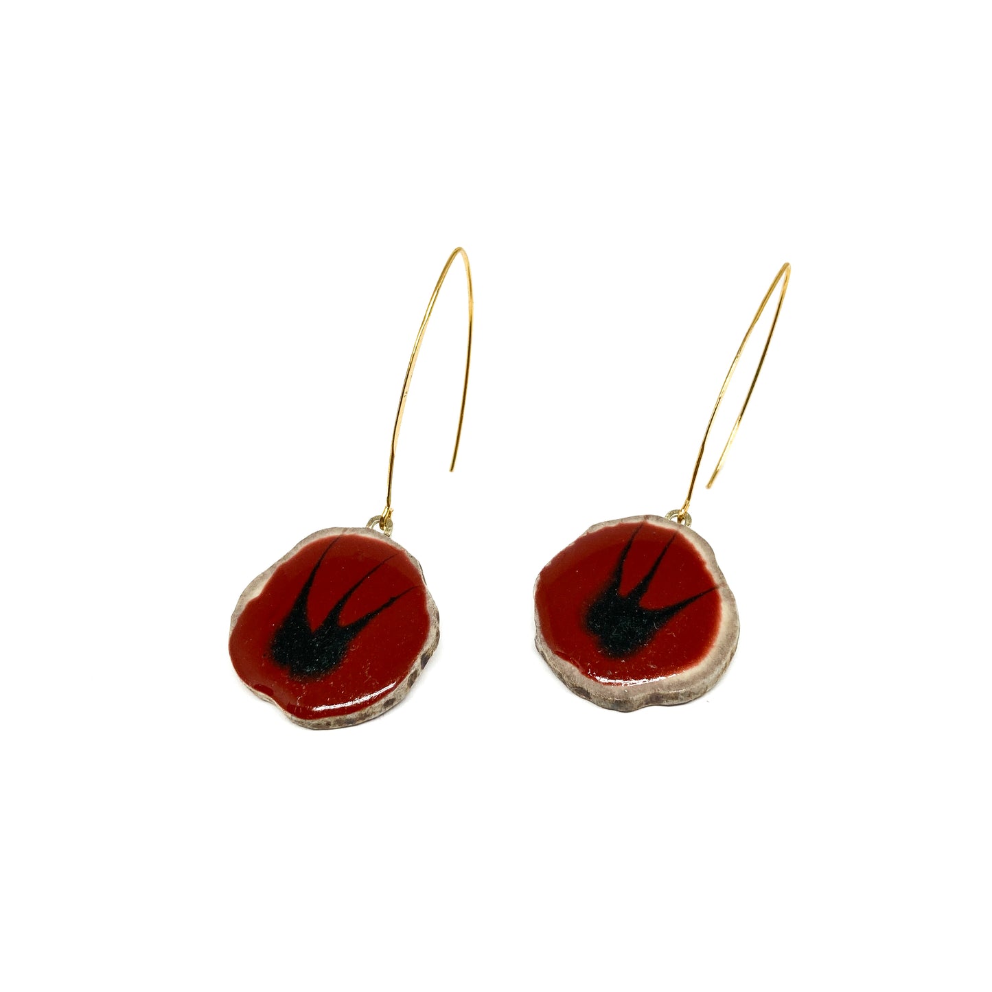 Two round earrings with red and black bird-shaped designs, featuring gold hooks.