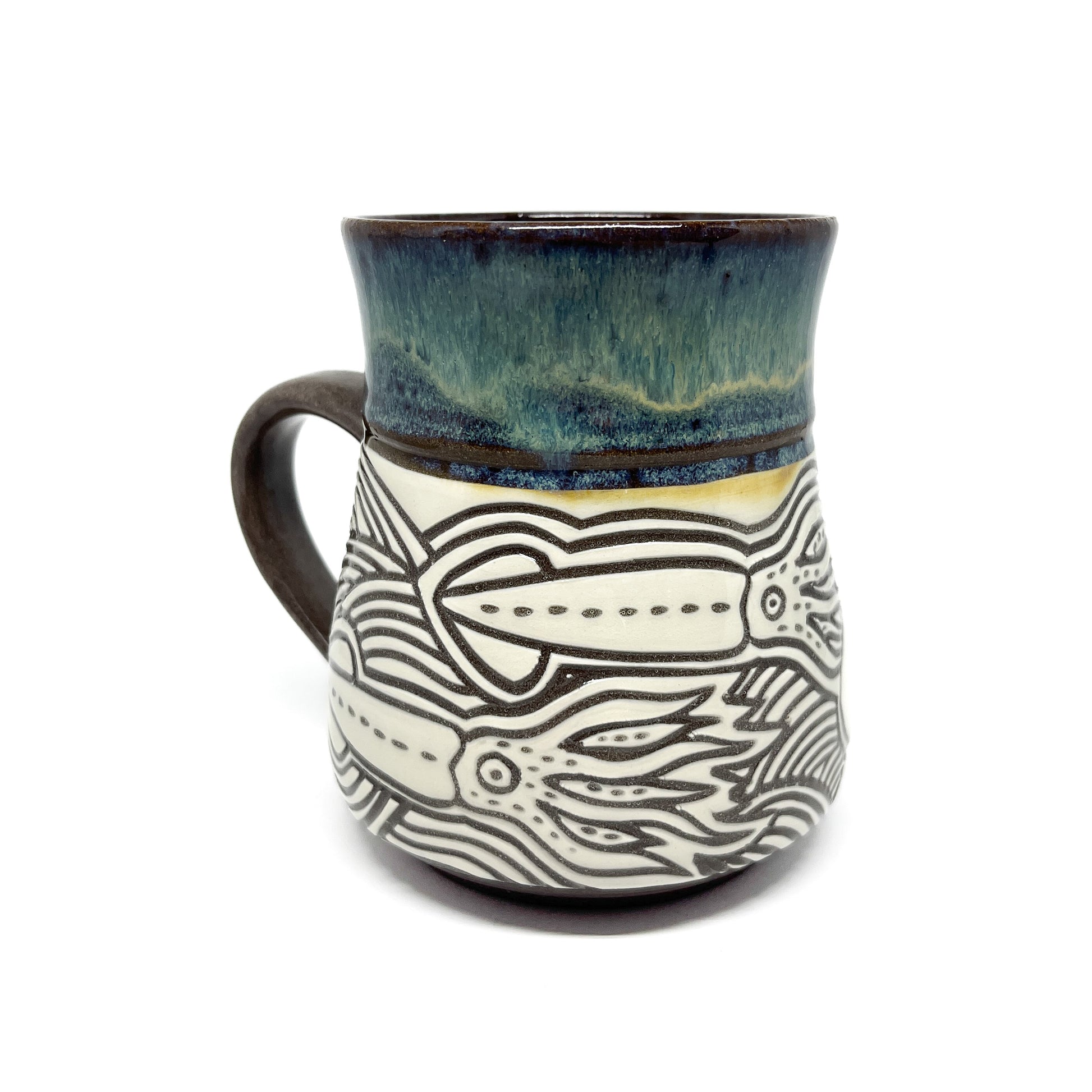 Ceramic mug with full octopus illustration, featuring swirling tentacles and a glazed top.