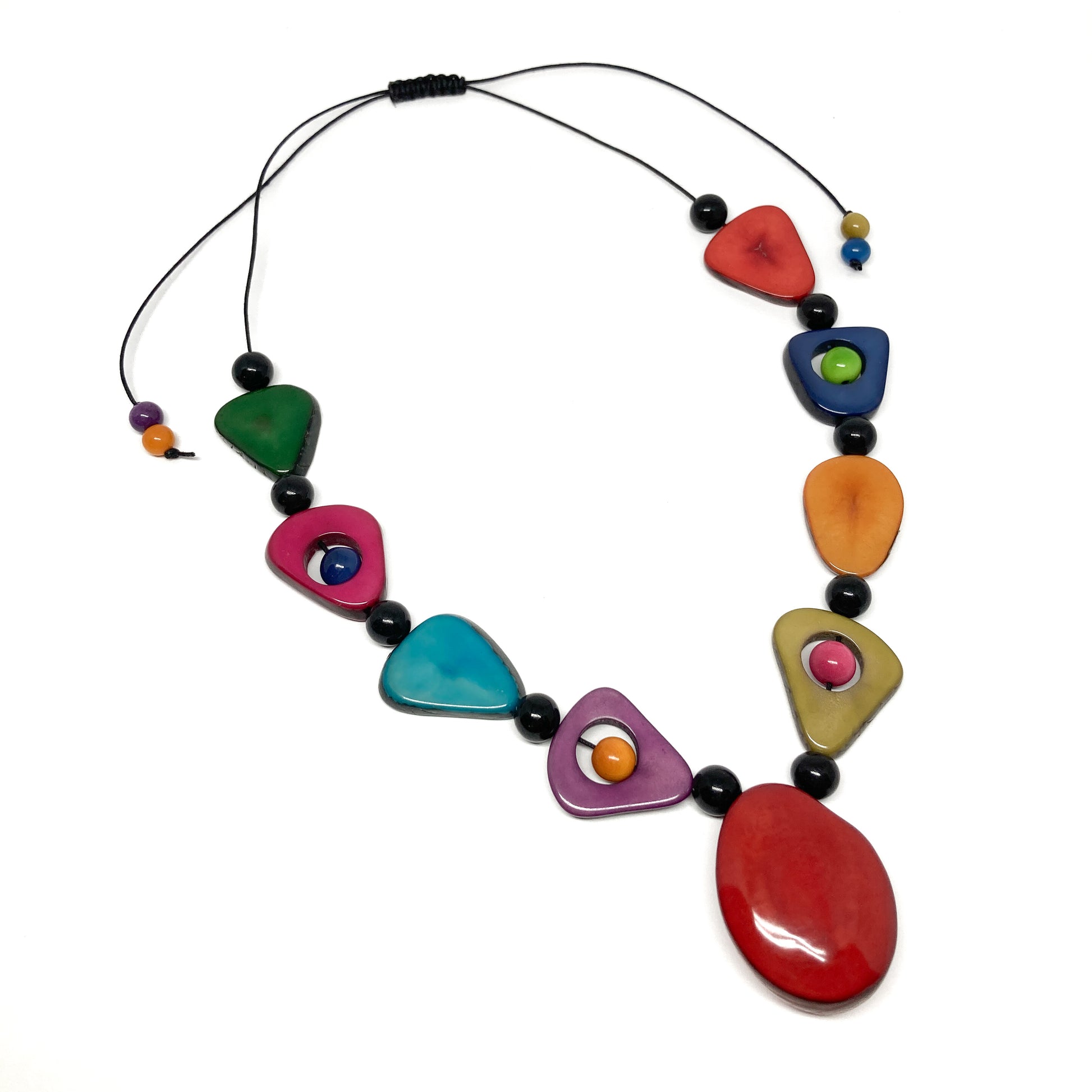 A necklace with colorful, irregularly shaped stones and black beads on a thin black cord.