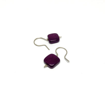 Two purple square earrings with silver hooks.
