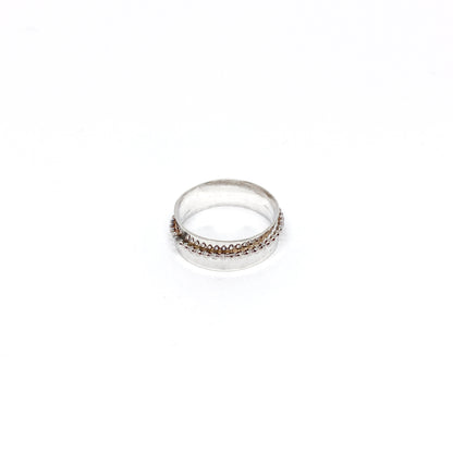 Handmade hammered sterling silver spinner ring with a beaded spinning band.