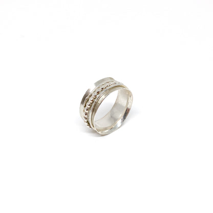 Silver spinner ring with multiple textured spinning bands, including a beaded row.