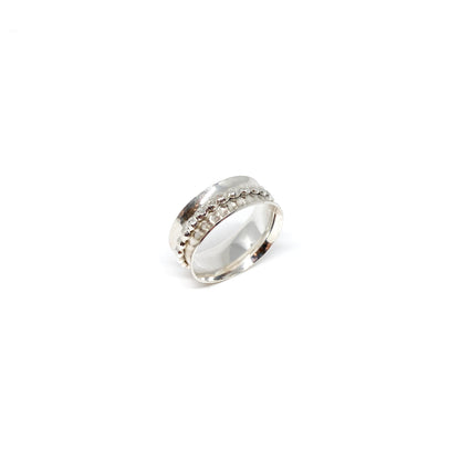 Silver spinner ring with a textured spinning band featuring rows of small dots.