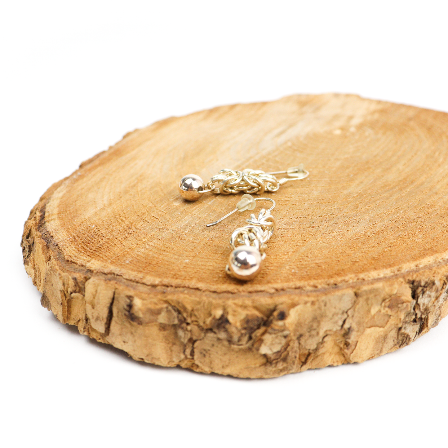 King Chain Dangle Earrings featuring tightly woven silver links and polished ball accents.