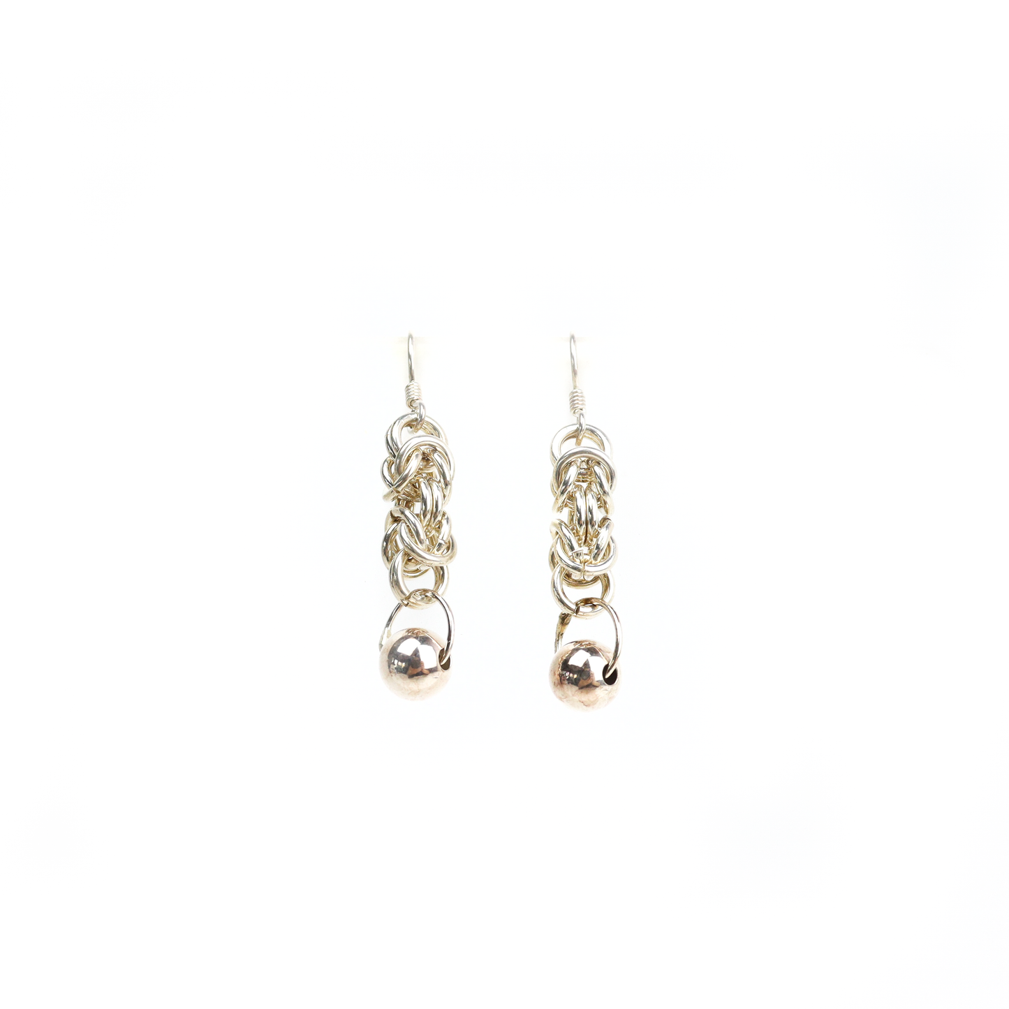 Straight view of King Chain Dangle Earrings showing woven silver links ending in a polished ball charm.
