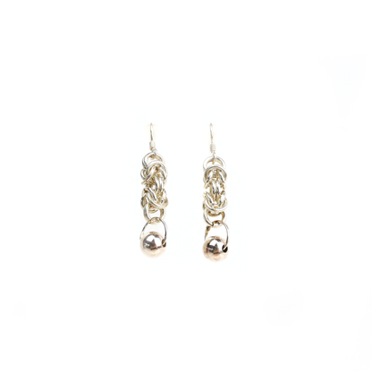 Straight view of King Chain Dangle Earrings showing woven silver links ending in a polished ball charm.
