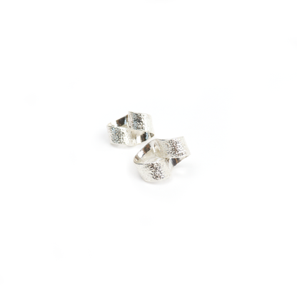 New York Button Studs featuring twisted silver loops with a textured hammered finish.