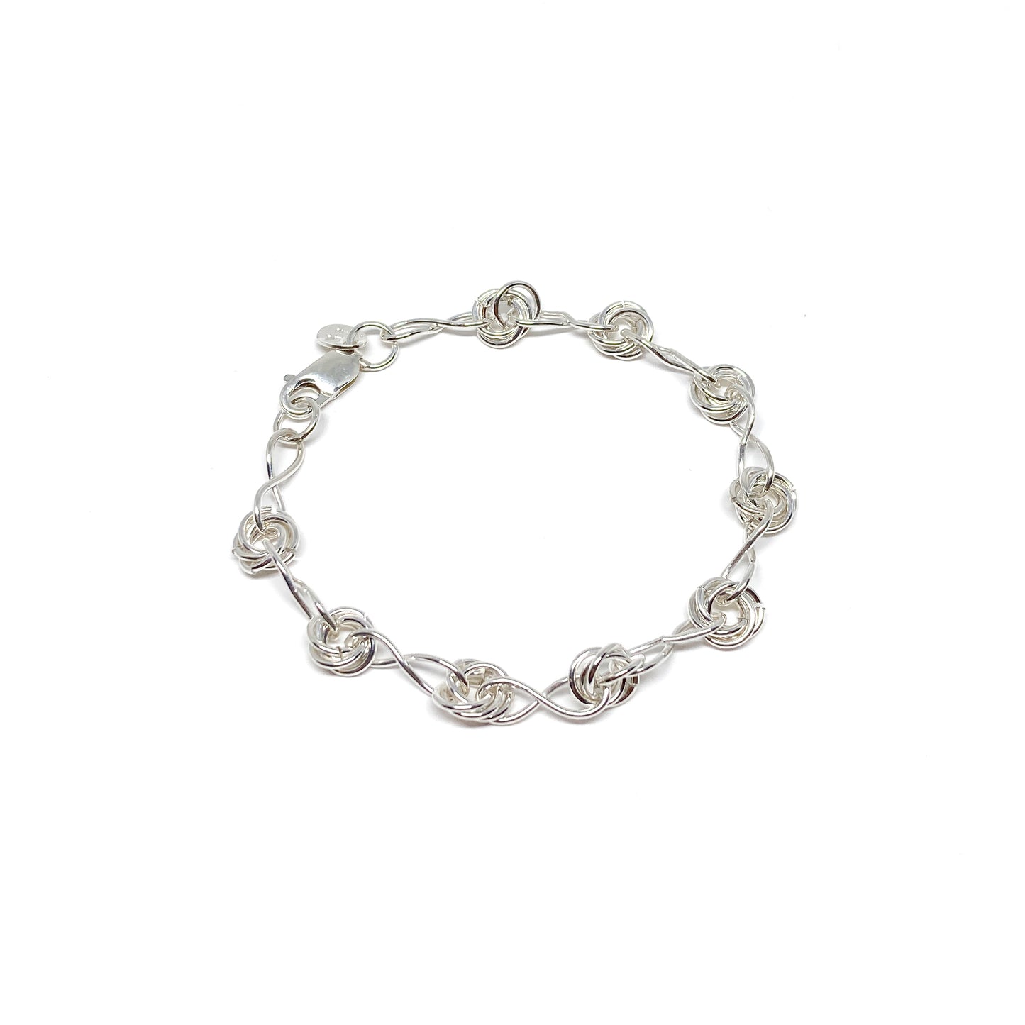 Infinity Knot Bracelet featuring interwoven rings and sleek links in a circular arrangement.