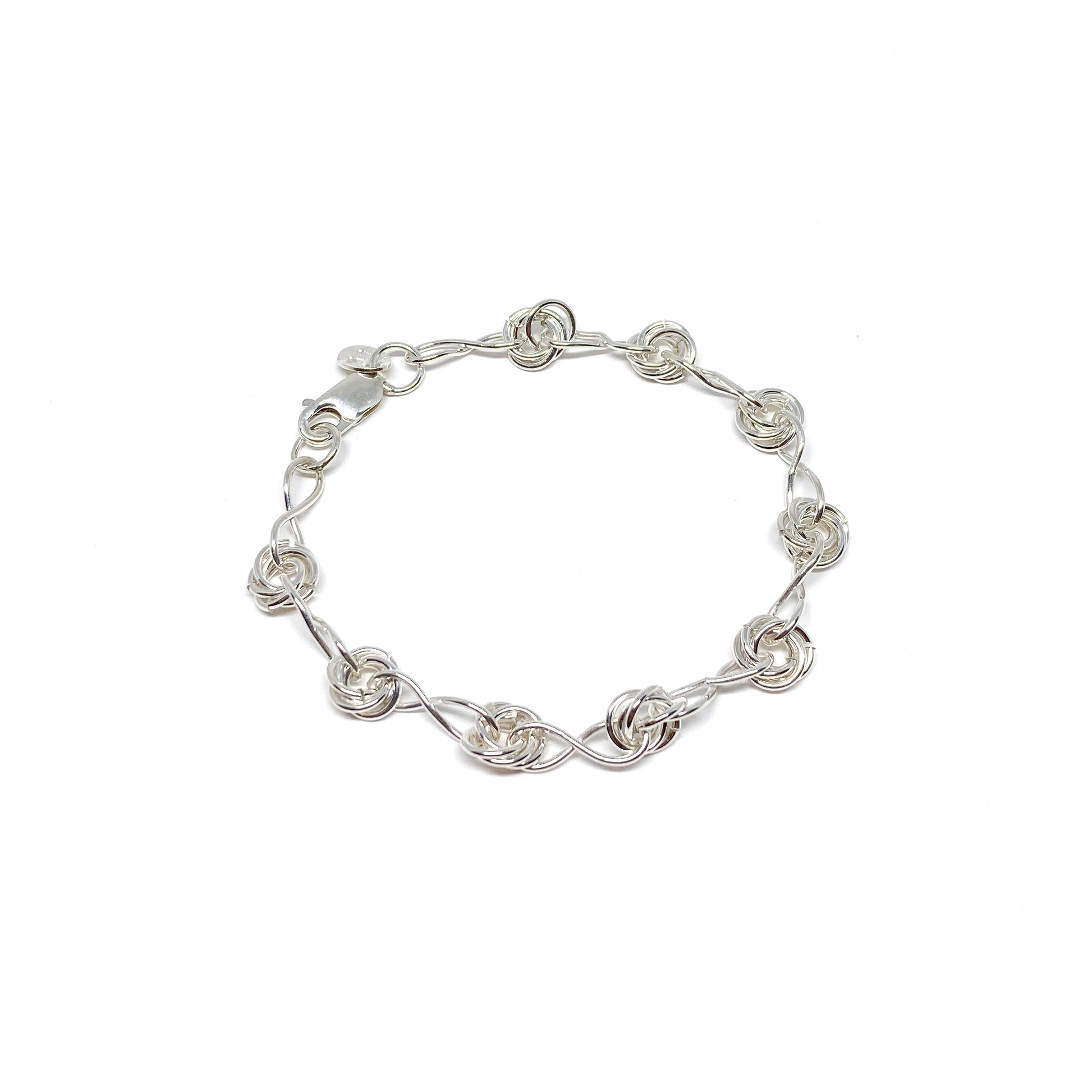 Infinity Knot Bracelet featuring interwoven rings and sleek links in a circular arrangement.