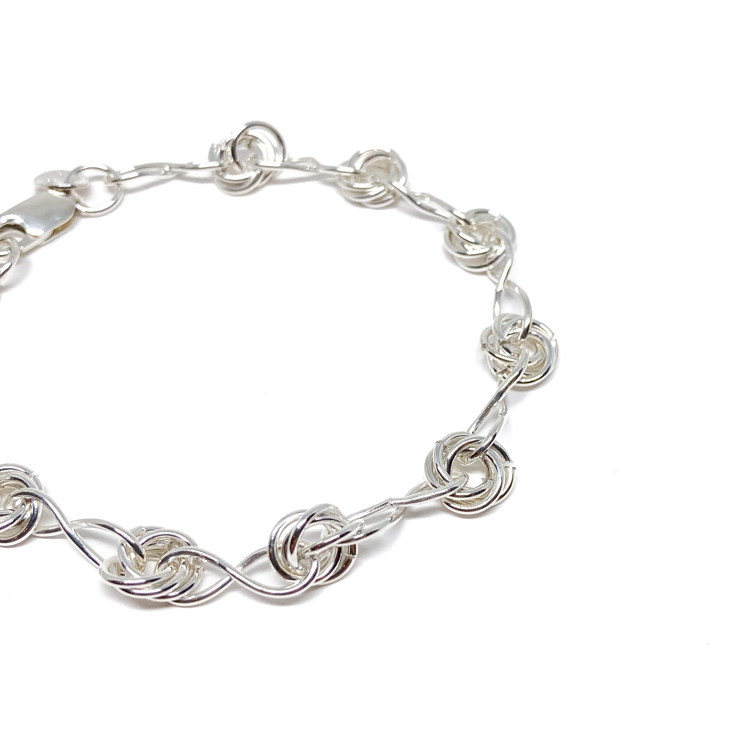 Close-up view of Infinity Knot Bracelet showcasing detailed twisted rings and interlocking links.