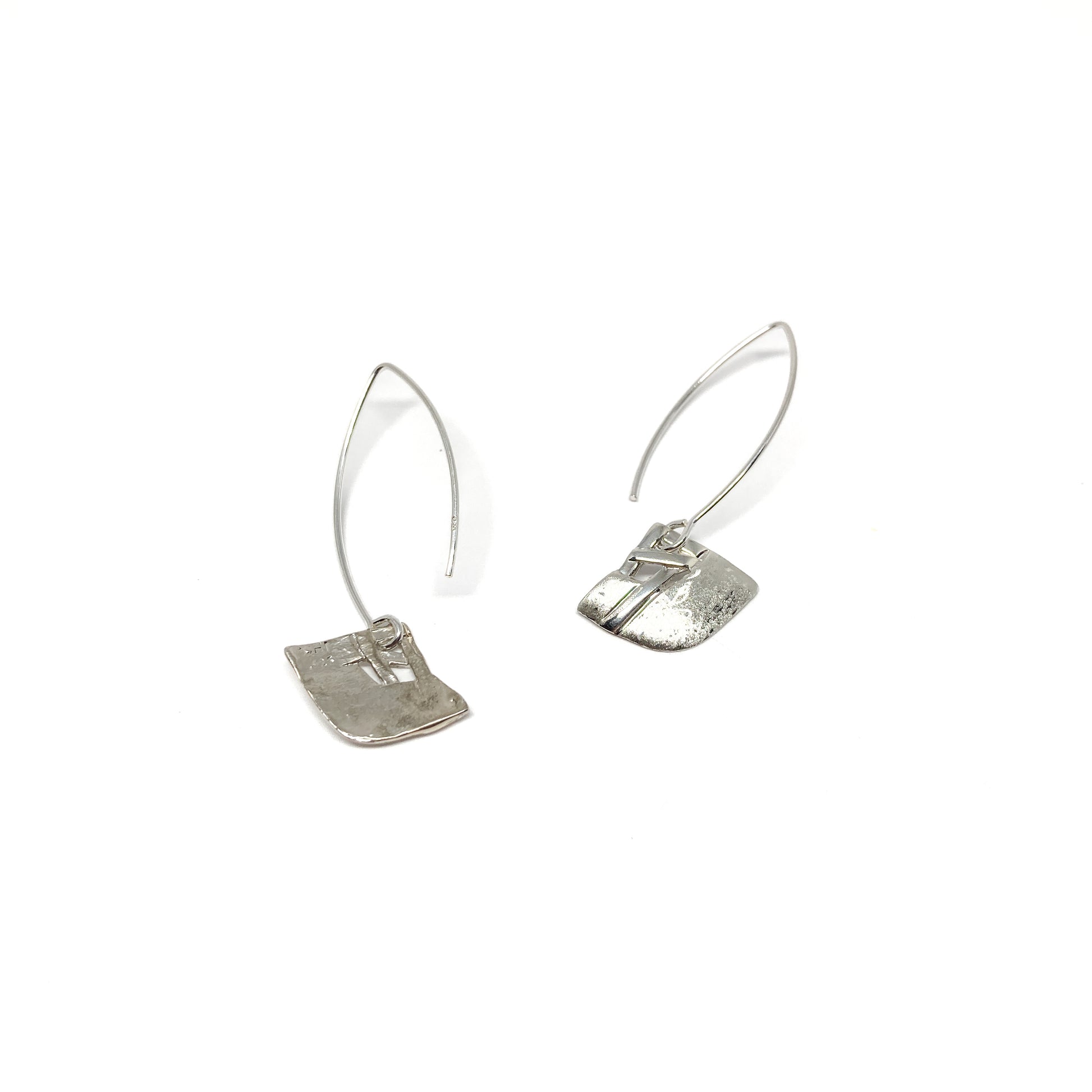 A pair of silver dangle earrings with a square woven design and a long, curved hook closure. The earrings have a textured finish.