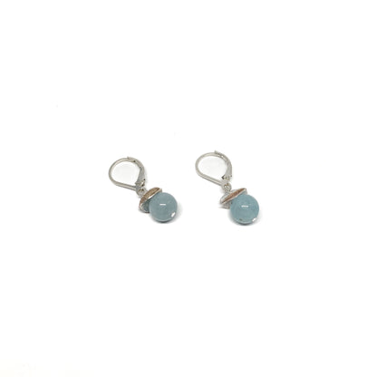 A pair of silver lever-back earrings with light blue beads and a textured, petal-like design. The earrings have a secure lever closure.