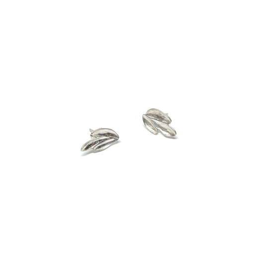 A pair of textured silver stud earrings with an abstract, overlapping petal or leaf-like design.