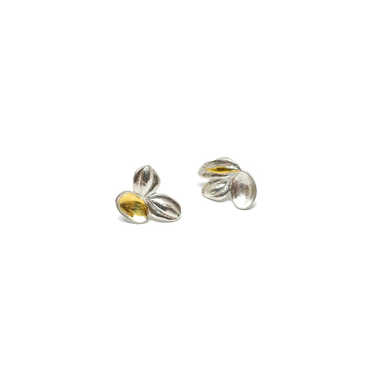 A pair of textured sterling silver stud earrings with abstract, overlapping petal-like shapes and Keum-Boo gold accents.