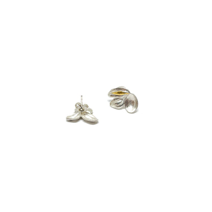 Two textured sterling silver stud earrings with abstract floral or leaf-like shapes and Keum-Boo gold detailing. One shows the post.