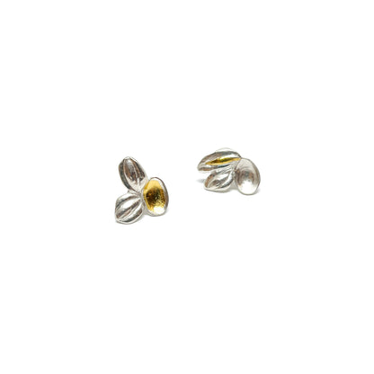 A pair of textured sterling silver stud earrings with abstract, organic shapes and contrasting Keum-Boo gold leaf accents.