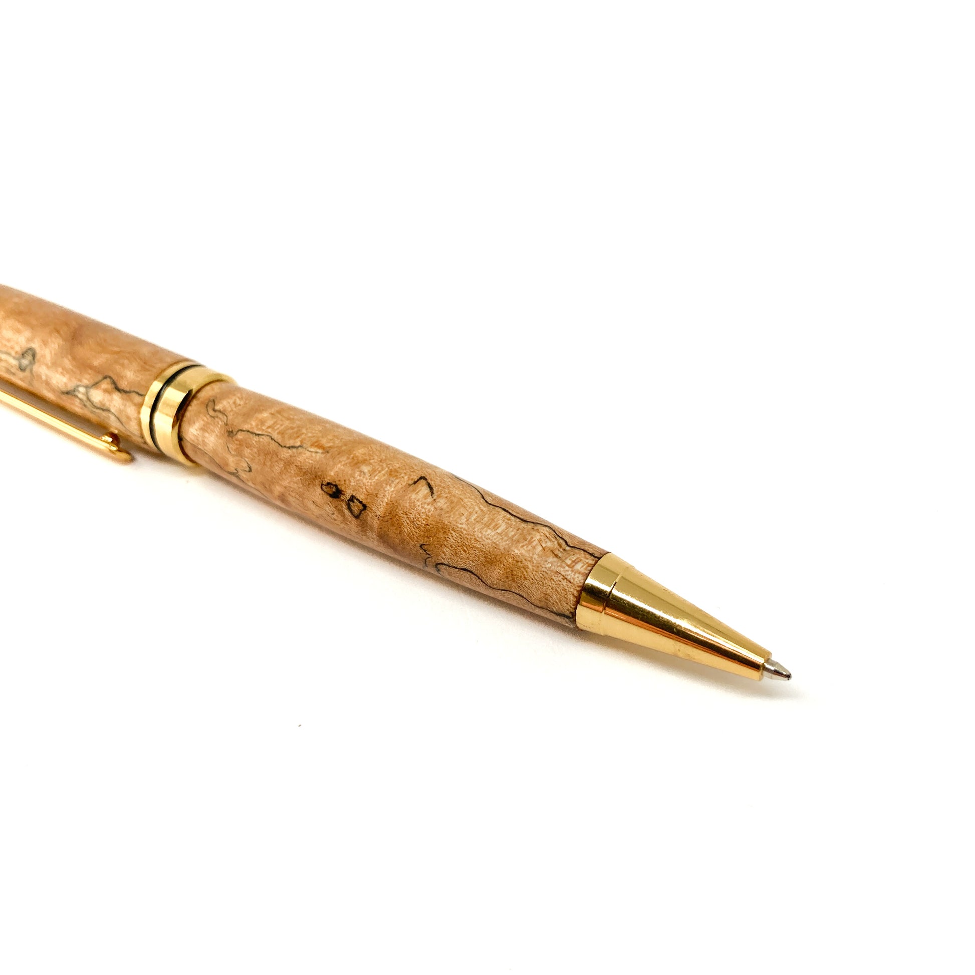 Wood pen with gold trim and tip, close-up view.