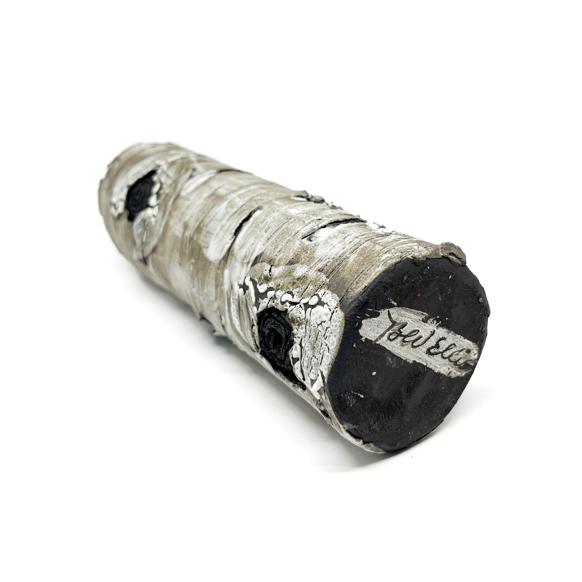 A cylindrical vase resembling birch bark with a textured surface, showing the artist's name "Bev Ellis".