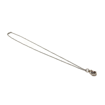 Small silver pendant on a delicate chain, angled view.